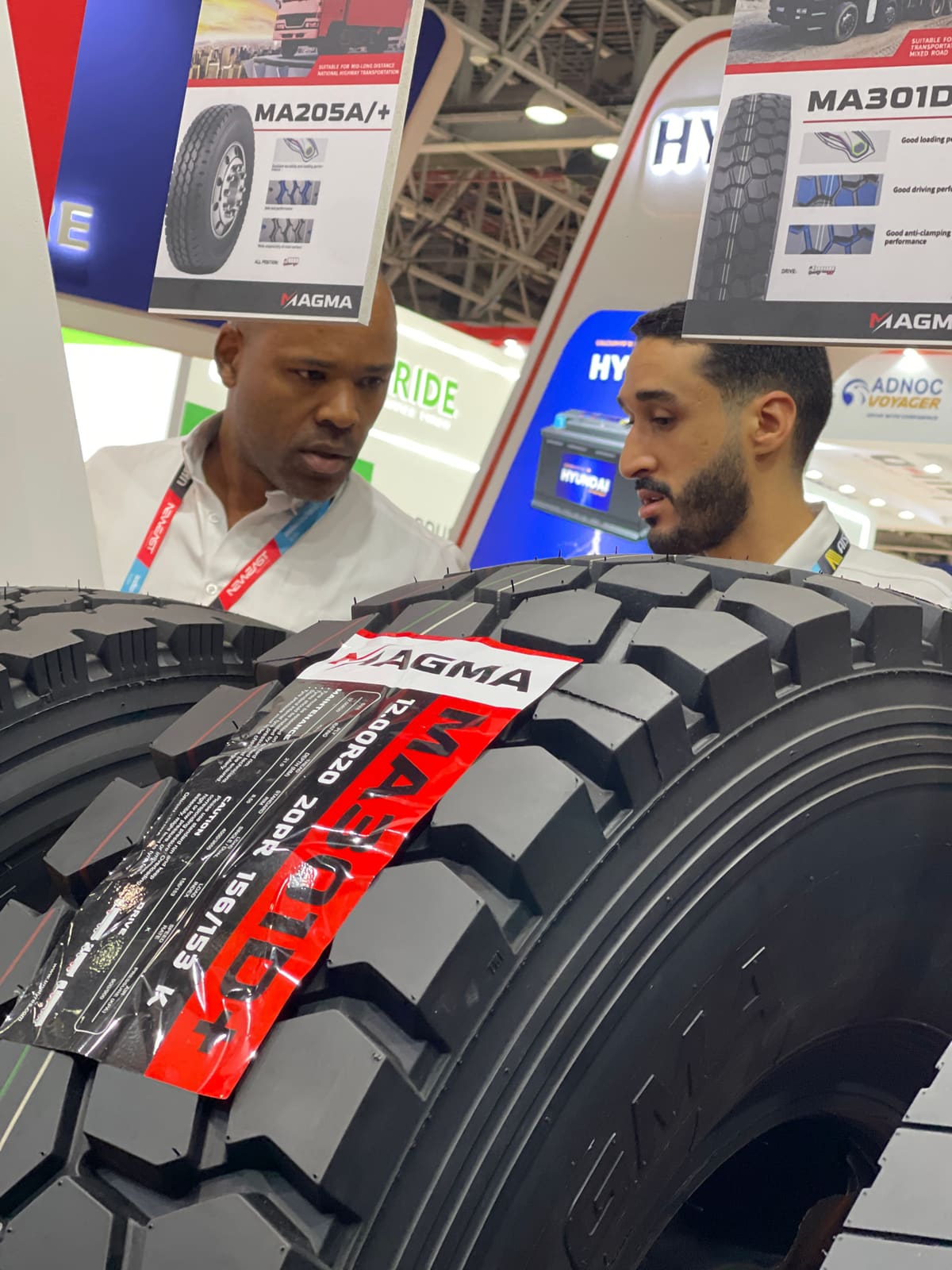 Visitor inspecting a MAGMA drive tyre tread